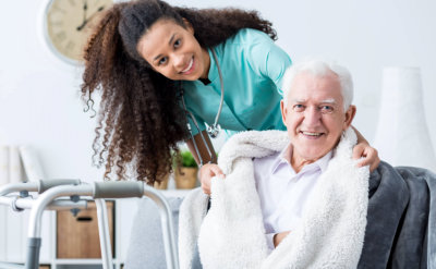 happy senior man with nurse