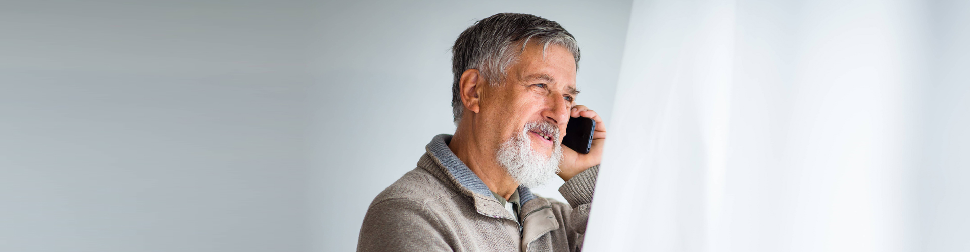 old man using his cellphone